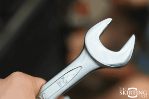 Father’s Day gift idea: A close-up of a high-quality wrench held by an RV owner ready for roadside repairs.